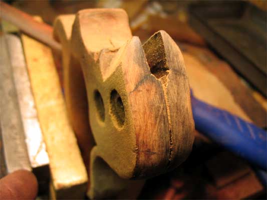 Repaired: Excess glue is removed using a file.